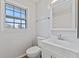 Clean bathroom with white vanity, toilet and shower at 2103 Danbury Dr, Indianapolis, IN 46231