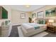 Elegant bedroom with dark hardwood floors and white bedding at 2103 Danbury Dr, Indianapolis, IN 46231
