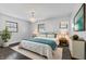 Spacious bedroom with dark hardwood floors and teal bedding at 2103 Danbury Dr, Indianapolis, IN 46231