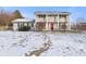 Two-story house with a red door and snow-covered lawn at 2103 Danbury Dr, Indianapolis, IN 46231