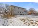 Back of house showing patio and snowy yard at 2103 Danbury Dr, Indianapolis, IN 46231