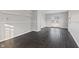 Bright bedroom with dark hardwood floors and french doors at 2103 Danbury Dr, Indianapolis, IN 46231