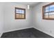 Empty spare bedroom with dark hardwood floors and large windows at 2103 Danbury Dr, Indianapolis, IN 46231
