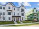 Charming new construction townhome with a white exterior, dark trim, and a well-manicured lawn at 4191 Barrel Ln, Westfield, IN 46062