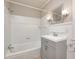Bathroom featuring a tub with shower and vanity with storage at 6502 Allisonville Rd, Indianapolis, IN 46220