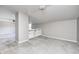 Spacious carpeted bonus room features built-in shelving, neutral paint, and ceiling fan at 6502 Allisonville Rd, Indianapolis, IN 46220