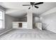 Carpeted bonus room with built in shelving that leads to the staircase at 6502 Allisonville Rd, Indianapolis, IN 46220