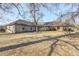 Sprawling single story ranch home with stone exterior and mature trees on a large lot at 6502 Allisonville Rd, Indianapolis, IN 46220