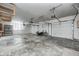 Spacious three car garage featuring multiple automatic doors and large open space at 6502 Allisonville Rd, Indianapolis, IN 46220