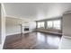 Spacious living room featuring a stone fireplace and hardwood floors at 6502 Allisonville Rd, Indianapolis, IN 46220