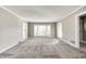 Bright and airy living room with neutral carpeting and ample natural light at 6502 Allisonville Rd, Indianapolis, IN 46220