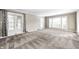 Inviting living room filled with light from a large window and glass doors at 6502 Allisonville Rd, Indianapolis, IN 46220