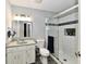 Bathroom featuring a glass shower with a white tiled wall and a shower niche at 7854 Harbour Isle, Indianapolis, IN 46240