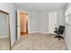 Bedroom with carpet, one window with blinds, an office chair, a closet, and a full size mirror at 7854 Harbour Isle, Indianapolis, IN 46240