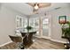 Cozy dining area featuring large windows and a stylish glass table at 7854 Harbour Isle, Indianapolis, IN 46240