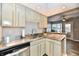 Bright kitchen offering stainless steel counters and views to an additional living area at 7854 Harbour Isle, Indianapolis, IN 46240