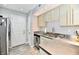 Well-lit kitchen with stainless steel countertops and modern appliances at 7854 Harbour Isle, Indianapolis, IN 46240