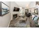 Bright living room with a fireplace, vaulted ceilings, and wood-look floors at 7854 Harbour Isle, Indianapolis, IN 46240