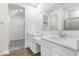 Elegant bathroom with dual vanity and walk-in closet at 9275 Loyola Way, Plainfield, IN 46168