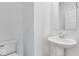 Clean bathroom with pedestal sink and toilet at 9275 Loyola Way, Plainfield, IN 46168