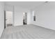 Spacious bedroom with grey carpet and ensuite bathroom access at 9275 Loyola Way, Plainfield, IN 46168