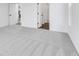 Bright bedroom featuring grey carpet and access to other rooms at 9275 Loyola Way, Plainfield, IN 46168