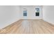 Bright and airy bedroom with wood-look flooring and neutral walls at 9275 Loyola Way, Plainfield, IN 46168
