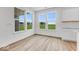Bright breakfast nook with large windows and wood-look flooring at 9275 Loyola Way, Plainfield, IN 46168