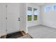 Bright entryway with white door and view to backyard at 9275 Loyola Way, Plainfield, IN 46168
