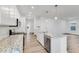Open concept kitchen with white cabinets and granite countertops at 9275 Loyola Way, Plainfield, IN 46168