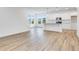 Open concept kitchen with white cabinets and granite island at 9275 Loyola Way, Plainfield, IN 46168