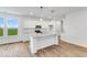 Modern kitchen with white cabinets, granite countertops and island at 9275 Loyola Way, Plainfield, IN 46168