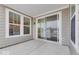 Covered patio with sliding glass doors and view of the backyard at 9275 Loyola Way, Plainfield, IN 46168