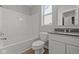Standard bathroom featuring a shower-tub combination and a vanity with a gray countertop at 10133 Redwood Peak Ln, Indianapolis, IN 46259