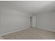An inviting bedroom with neutral carpet and a doorway to an adjacent room at 10133 Redwood Peak Ln, Indianapolis, IN 46259