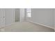 Bright bedroom view with doorway access to an adjacent room at 10133 Redwood Peak Ln, Indianapolis, IN 46259