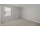 This bedroom features neutral walls, carpet, and natural light from a window at 10133 Redwood Peak Ln, Indianapolis, IN 46259