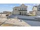 Attractive two-story home featuring a covered entry, and neatly kept snow-covered lawn at 10133 Redwood Peak Ln, Indianapolis, IN 46259