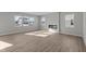 Spacious living room with a modern fireplace and abundant natural light from multiple windows at 10133 Redwood Peak Ln, Indianapolis, IN 46259