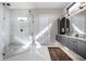 Bright bathroom featuring marble tile, a modern vanity, and a glass enclosed shower at 10937 Pete Dye Rdg, Zionsville, IN 46077