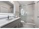 Modern bathroom featuring a vanity, and a glass-enclosed shower with subway tile at 10937 Pete Dye Rdg, Zionsville, IN 46077