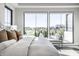 Bright bedroom featuring large windows with backyard views, and elegant decor at 10937 Pete Dye Rdg, Zionsville, IN 46077