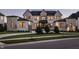 Stunning two-story home with a combination of white brick and stone, complemented by a well-manicured lawn at 10937 Pete Dye Rdg, Zionsville, IN 46077