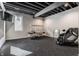 Spacious exercise room featuring rubber flooring, fitness equipment and natural light from the window at 10937 Pete Dye Rdg, Zionsville, IN 46077