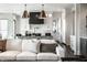 Modern kitchen with stainless steel appliances, a sleek island, and open layout, perfect for cooking and entertaining at 10937 Pete Dye Rdg, Zionsville, IN 46077