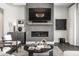 Stylish living room featuring a modern fireplace, unique decor, and comfortable seating for relaxation at 10937 Pete Dye Rdg, Zionsville, IN 46077