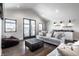 Spacious living area with vaulted ceilings, lots of seating, and a bar area at 10937 Pete Dye Rdg, Zionsville, IN 46077
