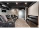 Home theater room featuring a projection screen, projector, and reclining seats at 10937 Pete Dye Rdg, Zionsville, IN 46077
