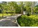Picturesque wooden walking bridge leading to a charming structure in a serene wooded setting at 10937 Pete Dye Rdg, Zionsville, IN 46077