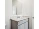 Bathroom with sink, grey vanity, white countertop, and large mirror at 7856 Magnolia St, New Palestine, IN 46163